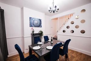 a dining room with a table and chairs at Aspen, 3 Bedrooms with Parking in Birmingham