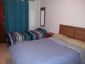 a bedroom with two beds in a room at Pozo Izquierdo Homelidays in Pozo Izquierdo