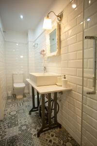 a bathroom with a sink and a toilet at Casa Severina in Alcoy +83 photos