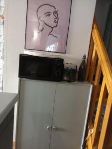 Kuchyňa alebo kuchynka v ubytovaní Maisonnette au cœur des Angles