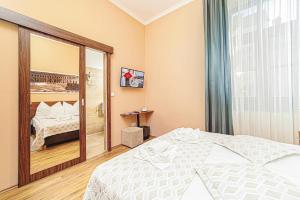 Postel nebo postele na pokoji v ubytování Forum Hotel