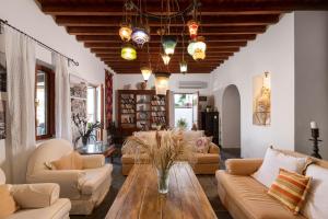 a living room with a couch and a table at Villa Venetoklis in Líndos