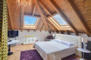 Un pat sau paturi într-o cameră la Villa Massari