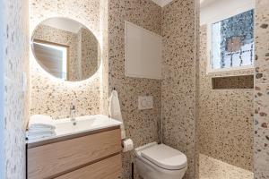 a bathroom with a toilet and a sink and a mirror at La Maison Du Pêcheur in Cagnes-sur-Mer +52 photos