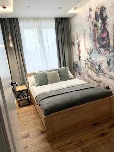 Ένα ή περισσότερα κρεβάτια σε δωμάτιο στο Apartament BIANCO PREMIUM z widokiem na Ratusz +5 φωτογραφίες