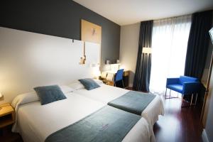 Letto o letti in una camera di Hotel El Coloquio