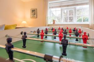 a group of toy soldiers playing a game of billiard at Ivy House Mells in Halesworth