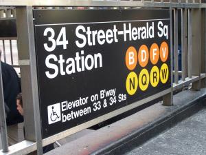 a sign for a street heated sat station at NYC Empire Apartments in New York