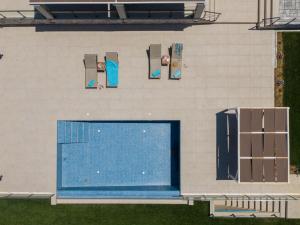 an overhead view of a swimming pool on a building at Marianna Villas - Aria - in Argostoli