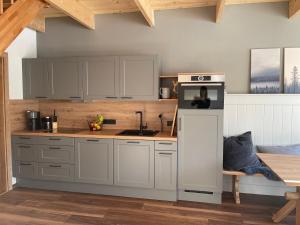 A kitchen or kitchenette at Larix Apartment