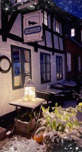 a model of a building with a bench in front of it at Restaurant Sælhunden in Ribe