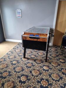 a glass table sitting on top of a rug at Caravan L16 in Mablethorpe
