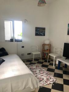 Ein Bett oder Betten in einem Zimmer der Unterkunft NATURAL CONFITAL BEACH