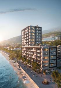 an architectural rendering of a building on the beach at Montesun RAF Apartments in Budva