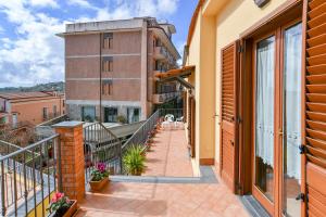 a balcony of a building with a walkway at Moon Smile in Massa Lubrense