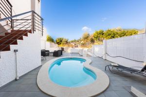 a swimming pool on the roof of a building at Torremuelle - Apartment with private pool & BBQ in Benalmadena in Benalmádena