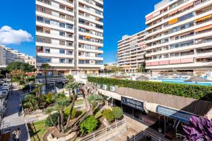 a view of a city with tall buildings at La Nogalera - Sea view apartment in the heart of Torremolinos in Torremolinos