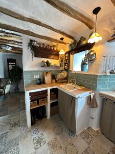 a kitchen with a sink and a counter top at Casa Fabian in Polopos