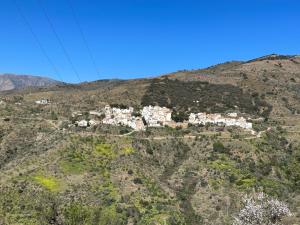 a village on the side of a mountain at Casa Fabian in Polopos