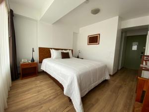 Postel nebo postele na pokoji v ubytování Faraona Grand Hotel