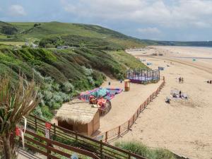 a beach with a roller coaster on the sand at 5 Seymour Villas in Woolacombe