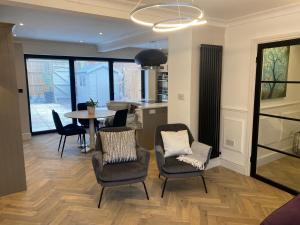 a kitchen and dining room with a table and chairs at Greens Walk in Liverpool