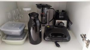 a kitchen counter with a blender and other appliances at Ubatuba North Shore in Ubatuba