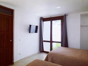 Cama o camas de una habitación en Hotel Casa San Juan