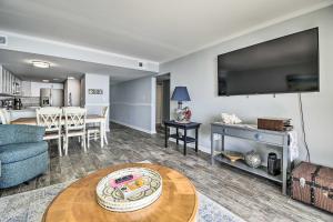 a living room with a couch and a table at Oceanfront Vacation Rental in Murrells Inlet! in Myrtle Beach