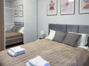 Posteľ alebo postele v izbe v ubytovaní Apartament Cudovny