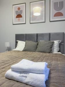 Posteľ alebo postele v izbe v ubytovaní Apartament Cudovny