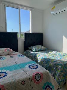 Cama o camas de una habitación en Apartamento Punta Gaira