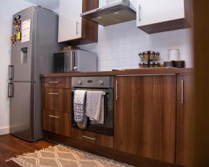 Η κουζίνα ή μικρή κουζίνα στο Luxury King Bed Near Old Trafford Stadium