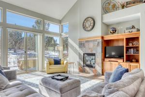 a living room with a couch and a fireplace at Creekside Village in Redmond