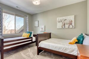 a bedroom with two beds and a window at Creekside Village in Redmond +39 photos
