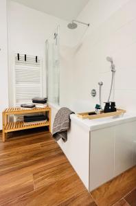 a white kitchen with a counter and a sink at Apartment Leo6 in Salzburg