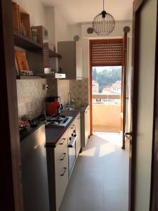 a kitchen with a sink and a stove top oven at Al Tochetìn in Schio
