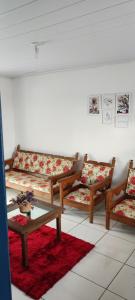 a living room with couches and a coffee table at Casa Vista para Serra in Tiradentes