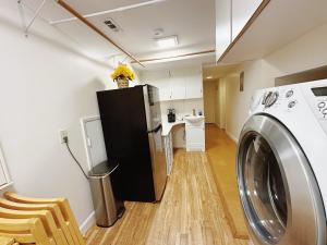 a laundry room with a washing machine in it at City Oasis in Issaquah