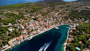 an aerial view of a town with a harbor at Apartmani Ada 1 in Povlja +11 photos