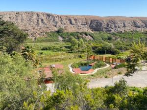 an aerial view of a garden with a pool at Cabañas Licanantay in Vallenar