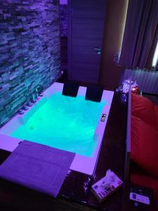 a hot tub with green water in a room at Countryside Hot & Romantic Room in Ceprano +94 photos
