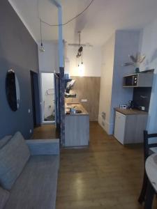 a living room with a couch and a kitchen at 555 метров до моря in Liepāja +16 photos