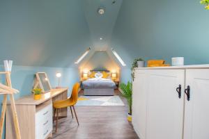 a bedroom with a bed and a desk in a room at The Yellow Door by Shortstays in Dublin