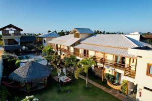 an aerial view of a resort with a pool at Pousada Paraiso dos Ventos Preá in Prea