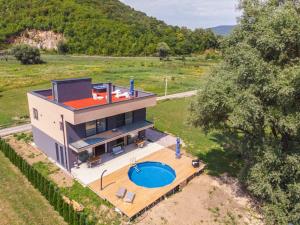 an aerial view of a house with a swimming pool at Lohovo Villa Bukva in Otoka