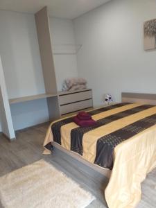 a bedroom with a large bed in a room at Retiro da Quinta do Souto in Peso da Régua