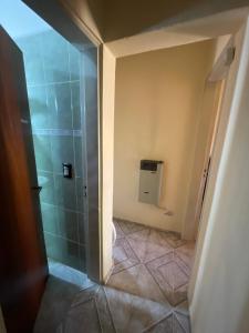 a bathroom with a shower and a toilet in a room at Casa FLORENCIA Céntrica in Villa Carlos Paz +19 photos