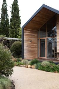 a house with a large window on the side of it at Riverstone in Porepunkah