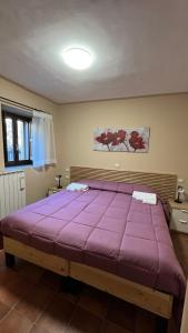 Un ou plusieurs lits dans un hébergement de l'établissement da sciuri case vacanza Barisciano